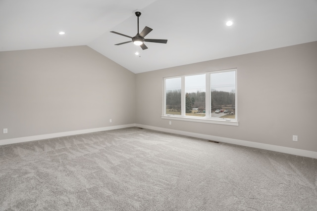 carpeted spare room with lofted ceiling, ceiling fan, recessed lighting, visible vents, and baseboards