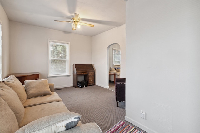 living room featuring ceiling fan and carpet floors