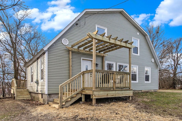 rear view of house featuring a pergola