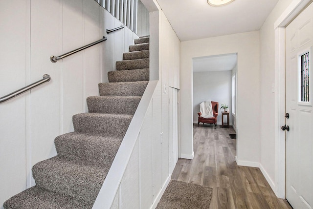 staircase featuring hardwood / wood-style flooring