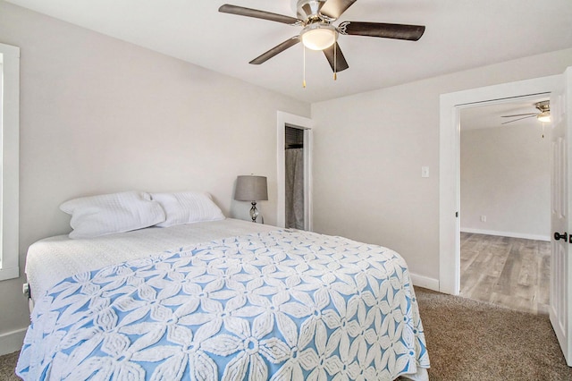 bedroom with ceiling fan and carpet