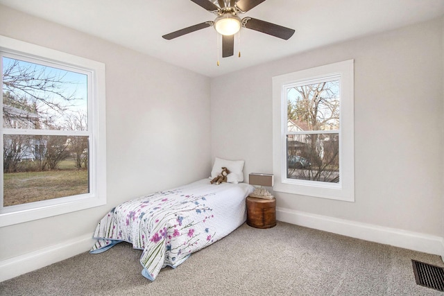 carpeted bedroom featuring ceiling fan