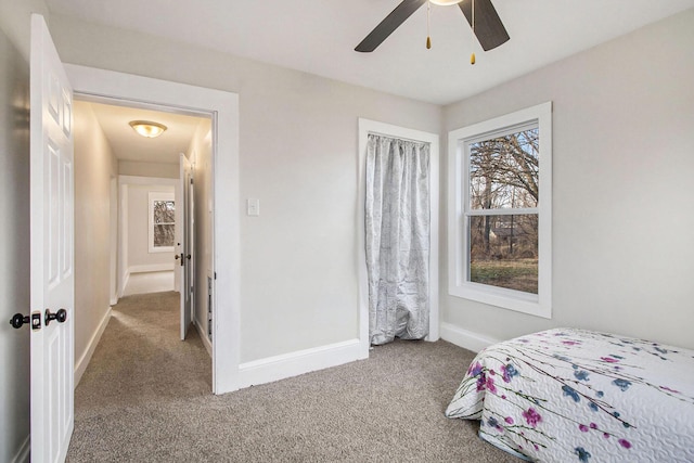 bedroom featuring ceiling fan and carpet floors