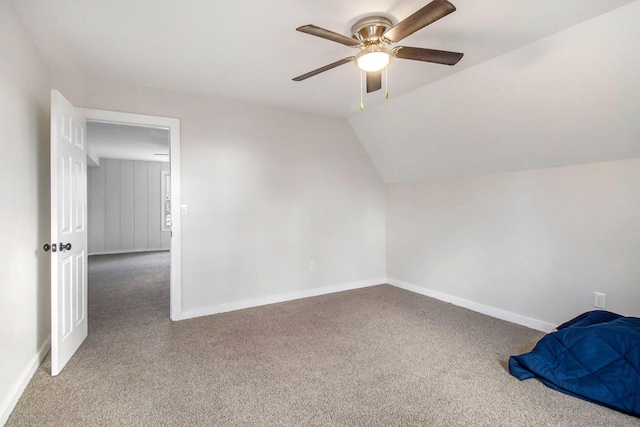 additional living space featuring lofted ceiling, carpet floors, and ceiling fan