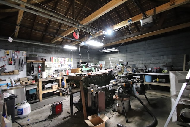 garage featuring a workshop area and a garage door opener