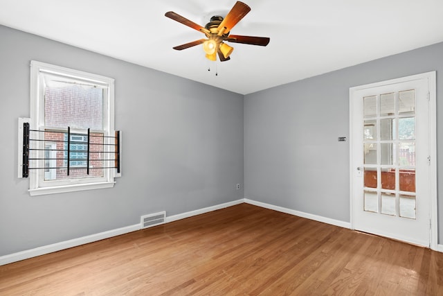 unfurnished room featuring wood-type flooring and ceiling fan