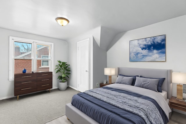 bedroom with light colored carpet