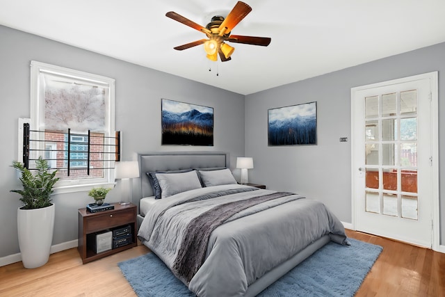 bedroom featuring light hardwood / wood-style floors and ceiling fan