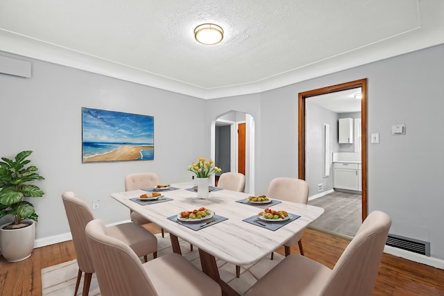 dining space featuring dark wood-type flooring