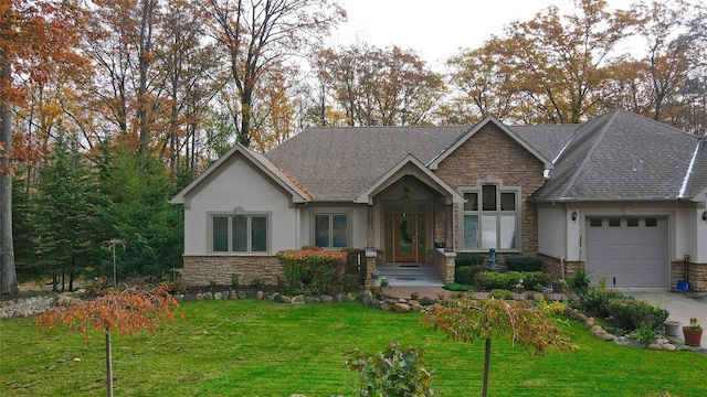 view of front of house featuring a garage and a front lawn