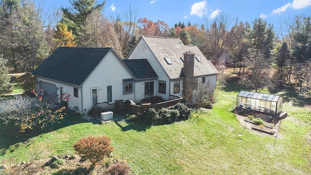 exterior space with a lawn and an outbuilding