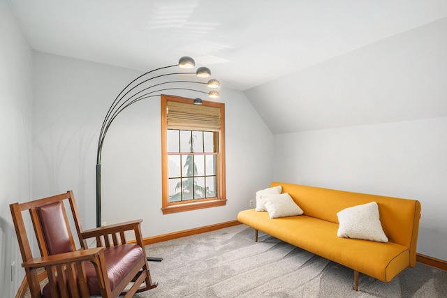 living area with light colored carpet and lofted ceiling