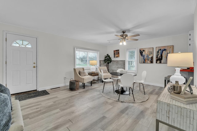 dining room featuring ceiling fan and light hardwood / wood-style flooring