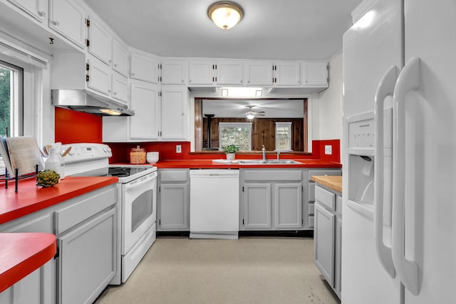 kitchen featuring white cabinets, ceiling fan, a healthy amount of sunlight, and white appliances