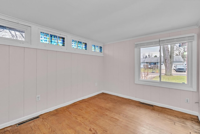 unfurnished room with light hardwood / wood-style floors