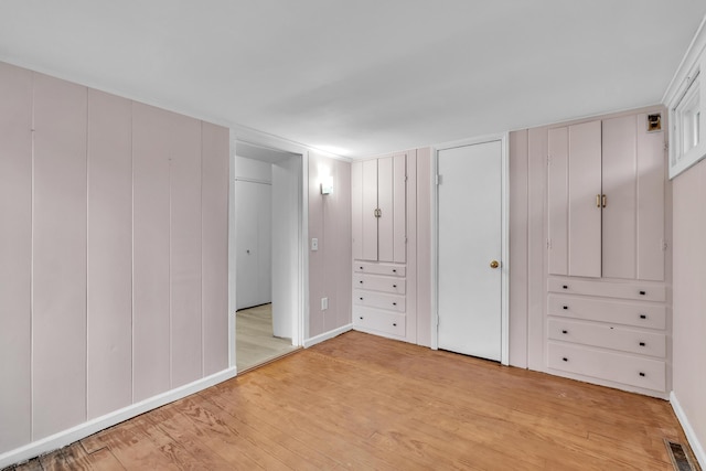 unfurnished bedroom featuring light wood-type flooring