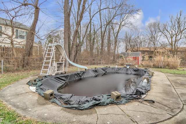 exterior space featuring a covered pool