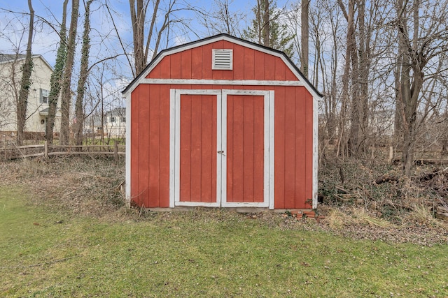 view of outdoor structure with a lawn