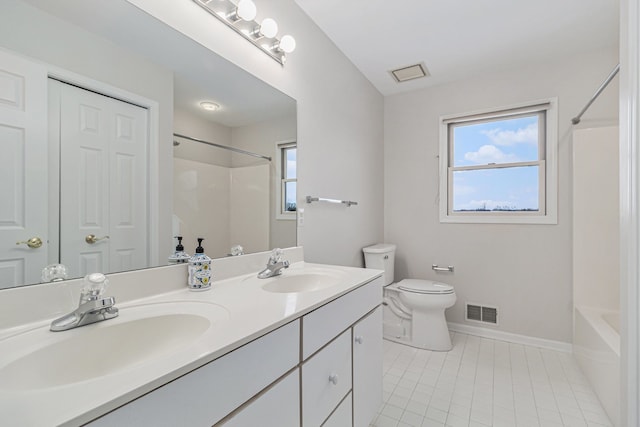 full bathroom featuring tile patterned floors, vanity, toilet, and shower / bathtub combination