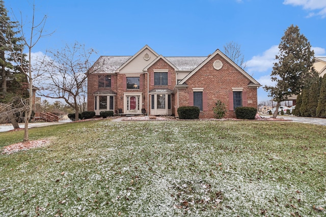 front facade featuring a front lawn