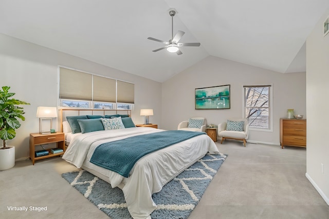 carpeted bedroom featuring ceiling fan and vaulted ceiling