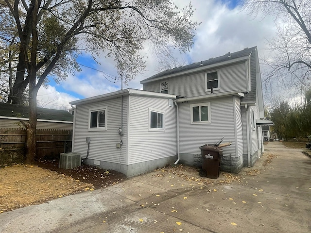 back of house featuring central AC unit