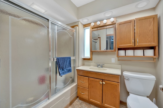 full bathroom featuring vanity, toilet, and enclosed tub / shower combo