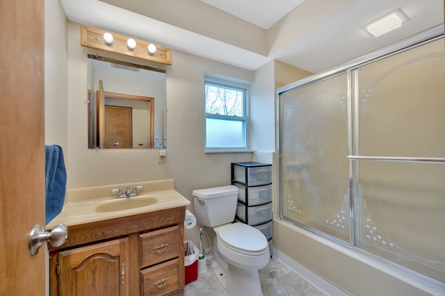 full bathroom featuring vanity, toilet, and bath / shower combo with glass door