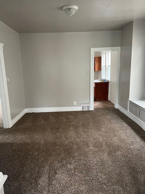 unfurnished bedroom featuring carpet flooring