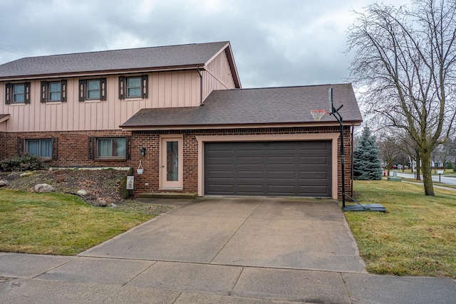 view of front of property with a garage and a front yard