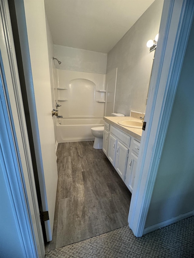 381 Kleiner St, Frankenmuth, MI 48734 - bathroom featuring vanity, toilet,  shower combination, and wood finished floors
