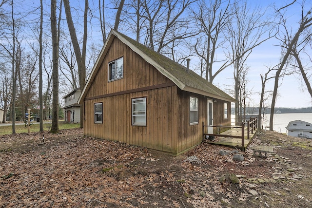 view of side of home featuring a water view