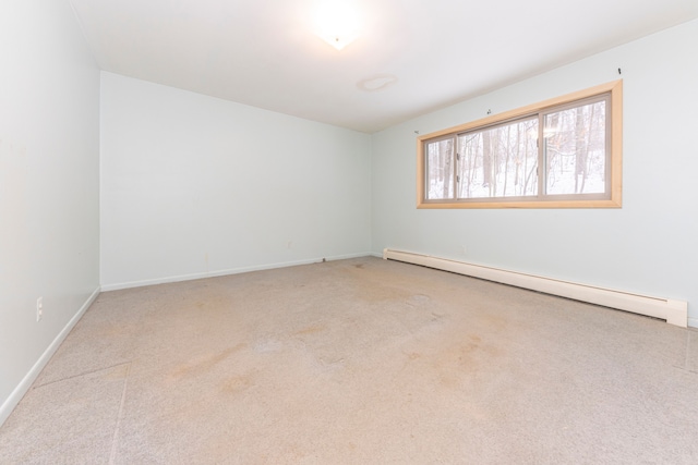 empty room featuring baseboard heating