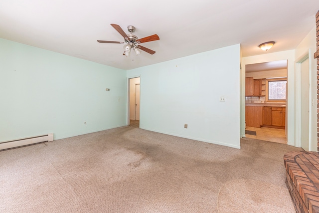 unfurnished room with ceiling fan, light carpet, and a baseboard heating unit