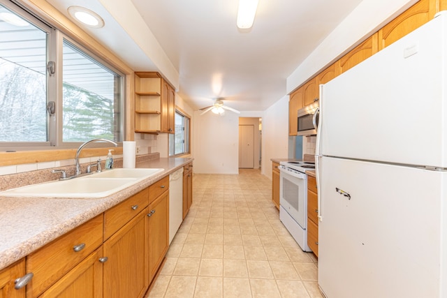 kitchen with ceiling fan, white appliances, and sink