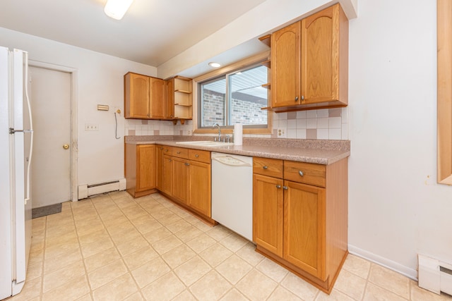 kitchen featuring decorative backsplash, white appliances, sink, and a baseboard heating unit