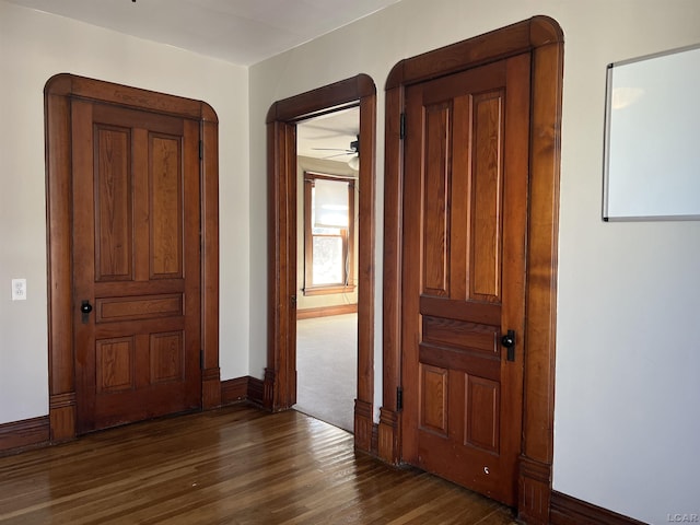 hall featuring dark wood-type flooring