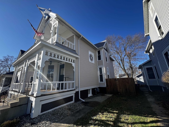 view of property exterior featuring a porch