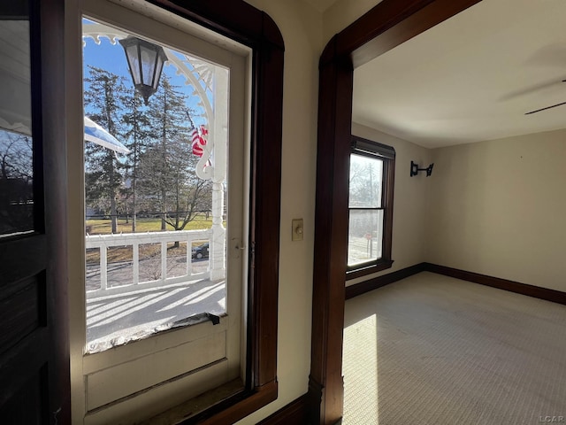 doorway featuring carpet