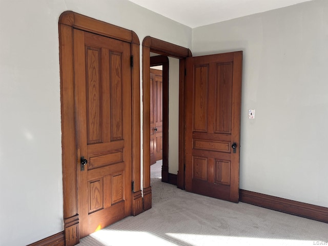 bedroom featuring light colored carpet