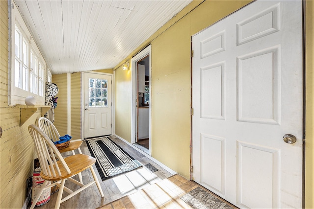 sunroom featuring wood ceiling