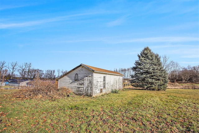 view of outdoor structure with a lawn