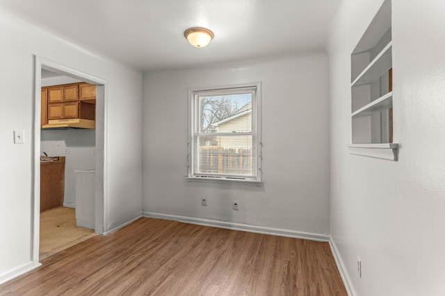 unfurnished room featuring hardwood / wood-style floors