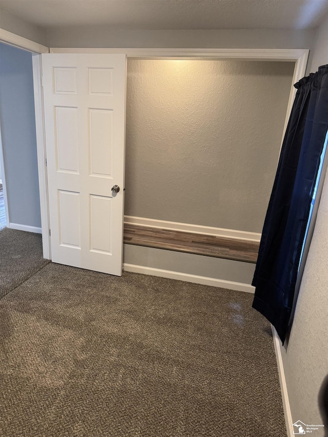 unfurnished bedroom featuring carpet flooring