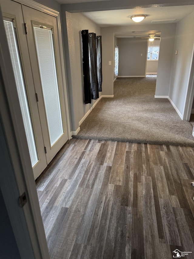 hallway with wood-type flooring