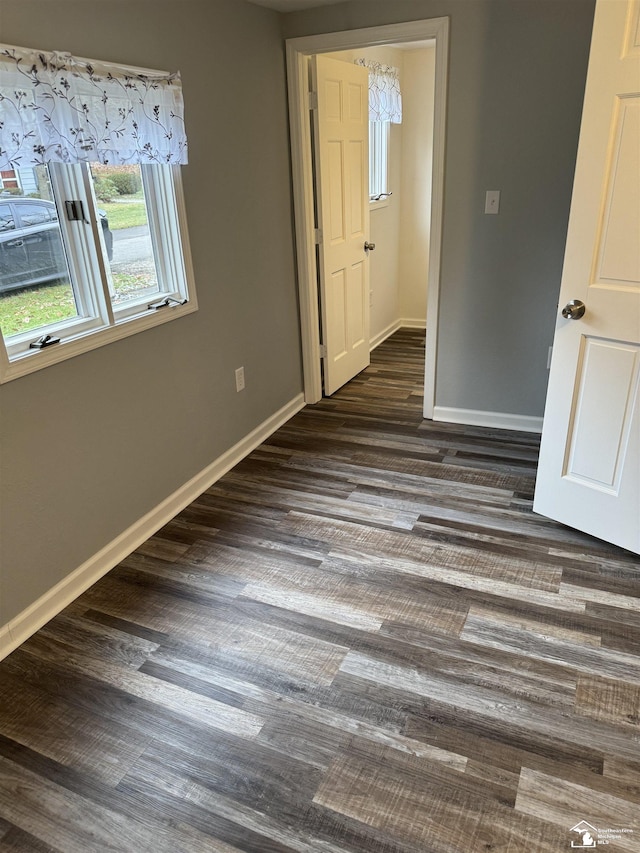 unfurnished bedroom featuring dark hardwood / wood-style floors