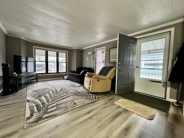 living room with crown molding and hardwood / wood-style flooring