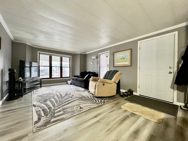 living room with crown molding and light wood-type flooring