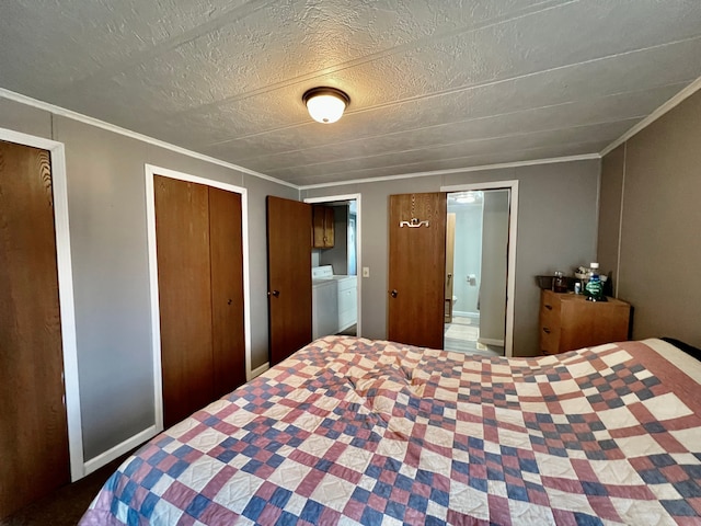 bedroom featuring ensuite bath, crown molding, and washer and dryer