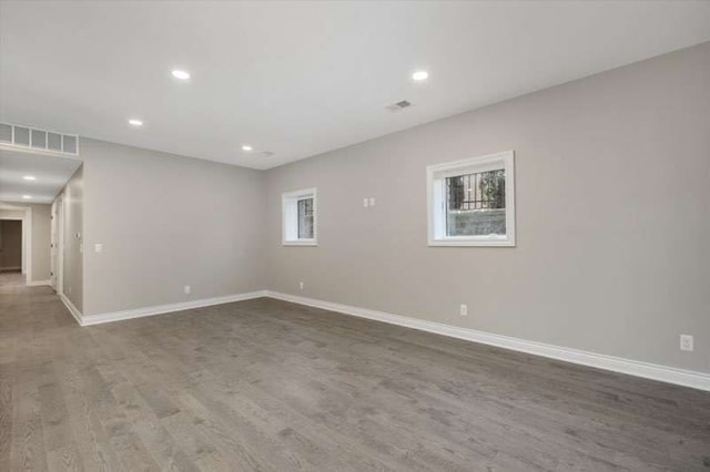 unfurnished room with hardwood / wood-style floors